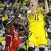 Michigan freshman Nik Stauskas takes a shot over North Carolina State junior C.J. Leslie during the first half at Crisler Center on Tuesday night. Melanie Maxwell I AnnArbor.com